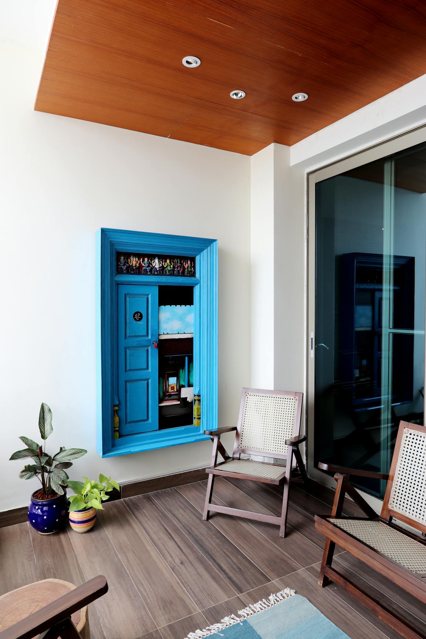 Stylish interior featuring a blue cabinet and modern furniture in a contemporary setting.